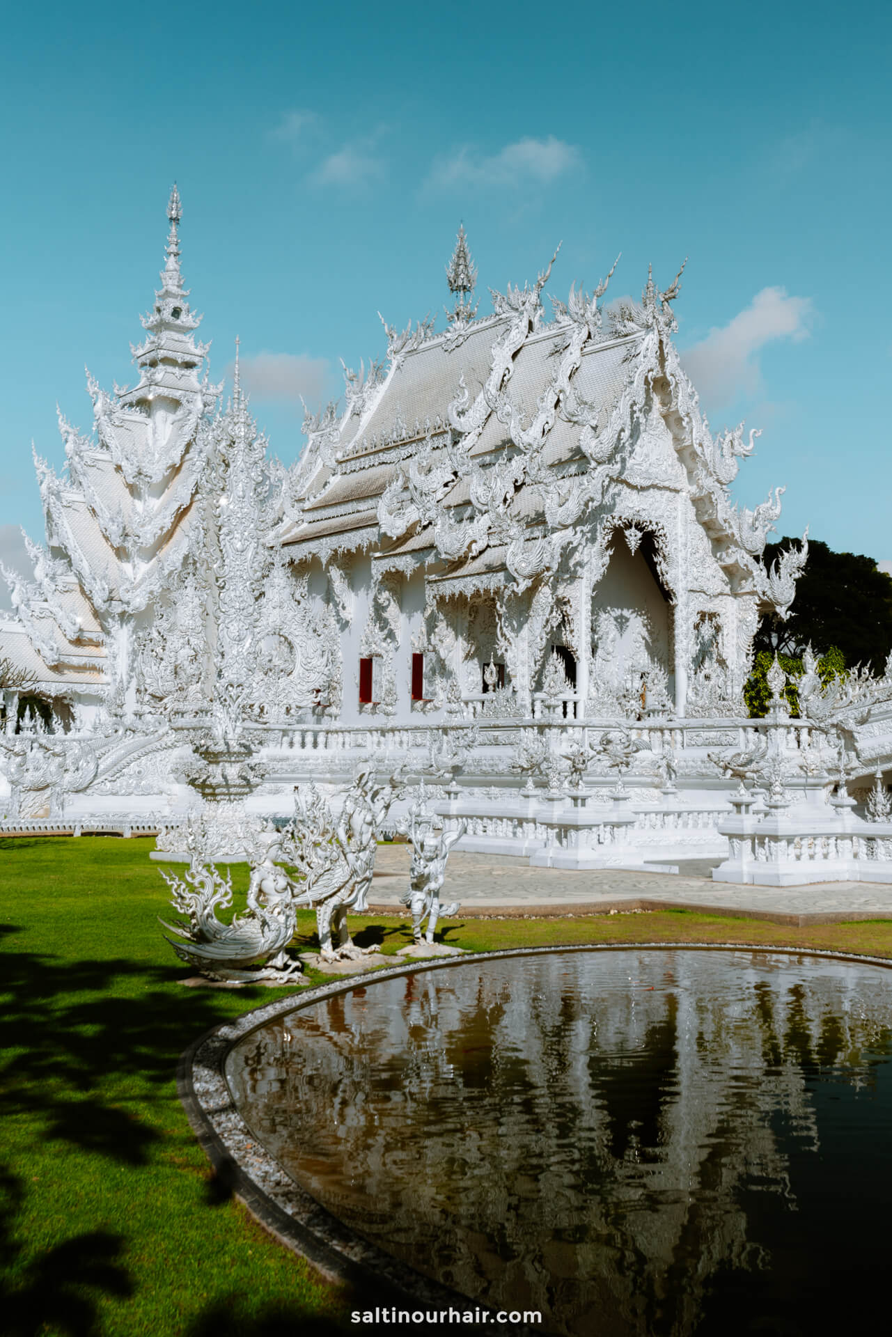 white temple chiang rai side view