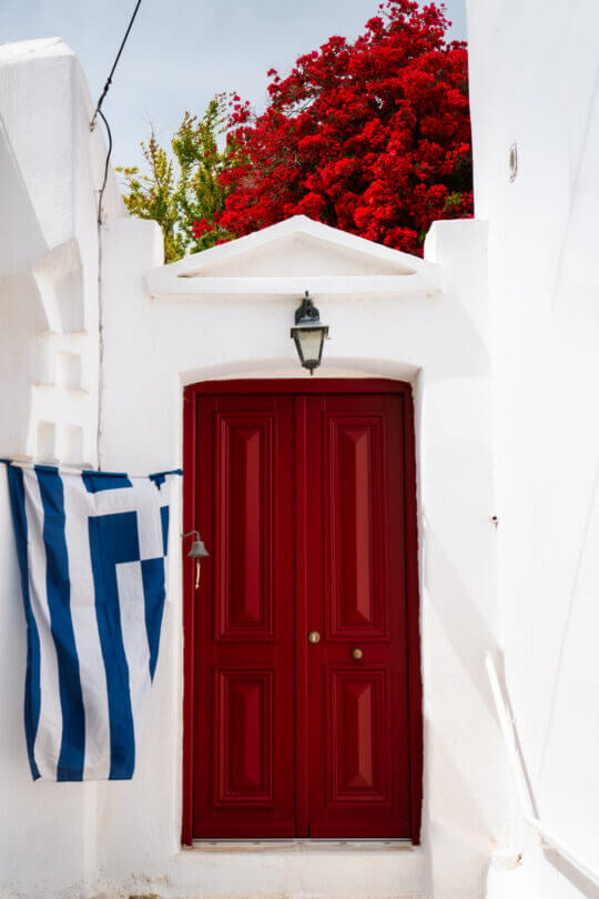 red door with greek flag