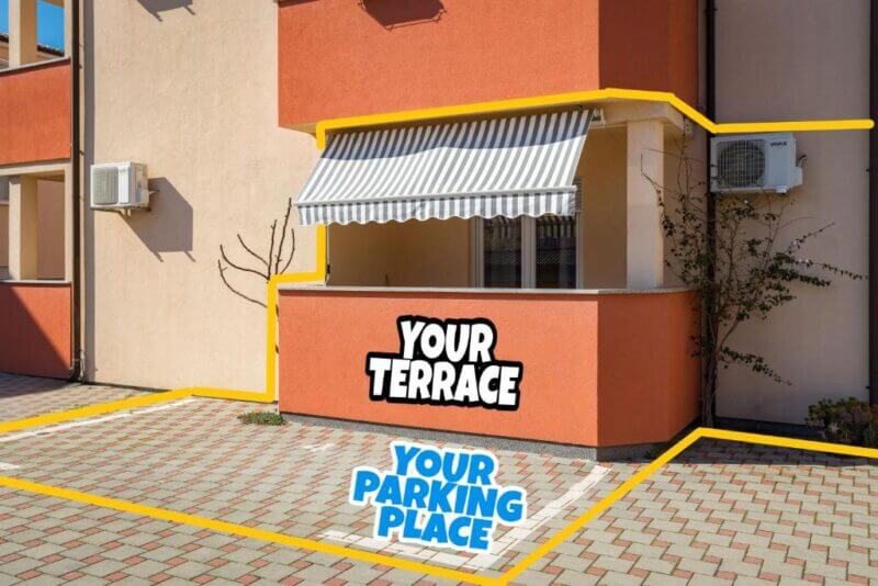 Photo of Studio Vita Pula building exterior with labeled terrace and parking place outlined in yellow, featuring an awning, air conditioner, and brick-patterned ground.