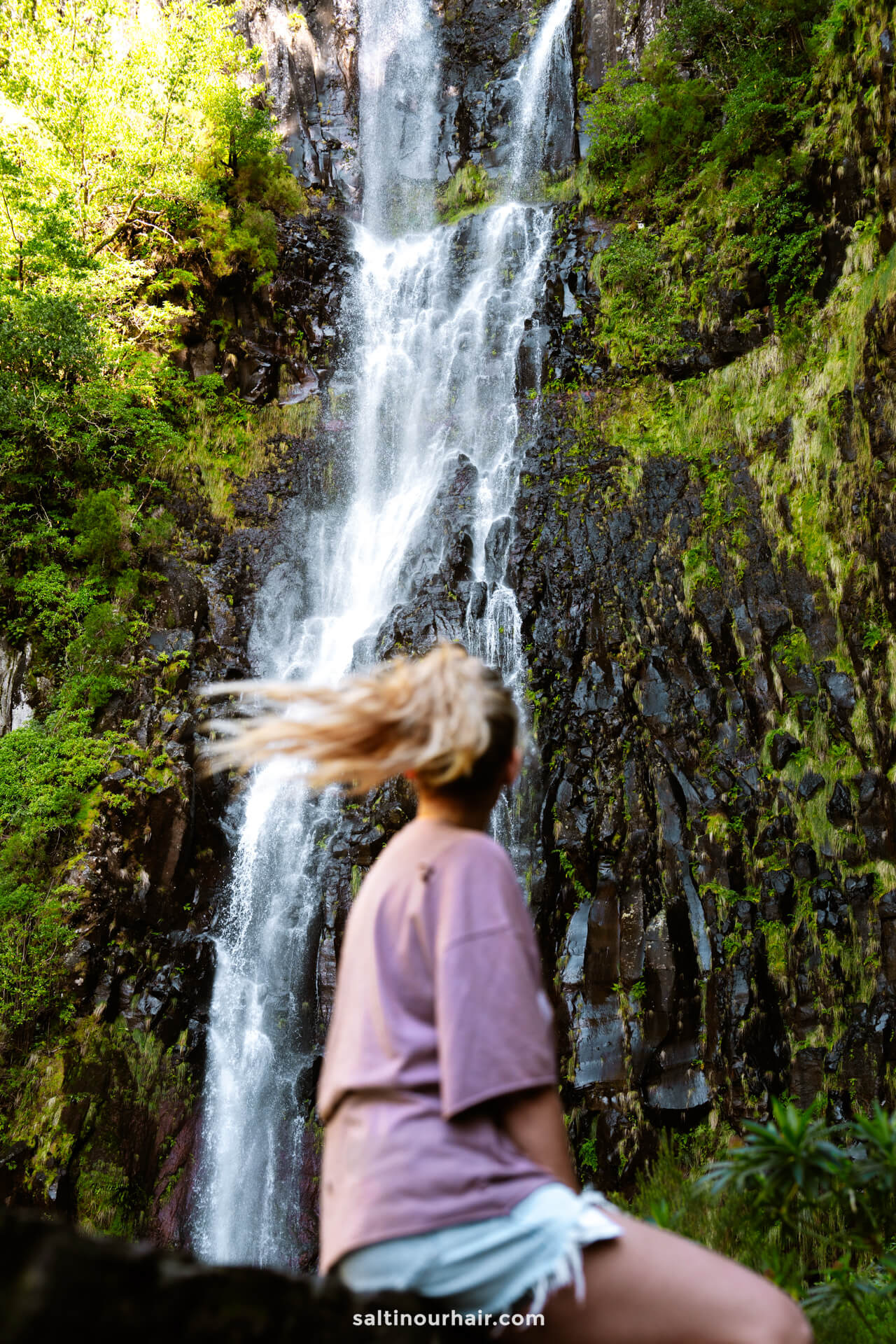 levada das 25 fontes girl looking at risco waterfall madeira