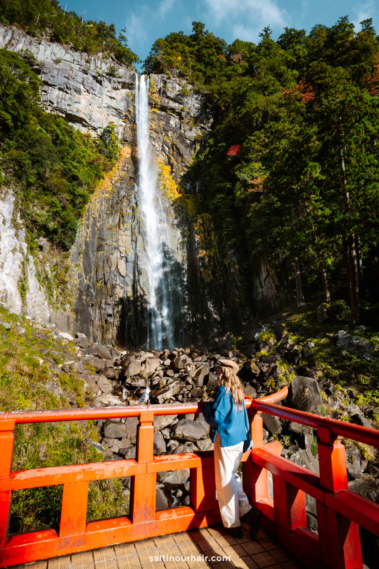 woman visiting nachi falls japan tallest waterfall