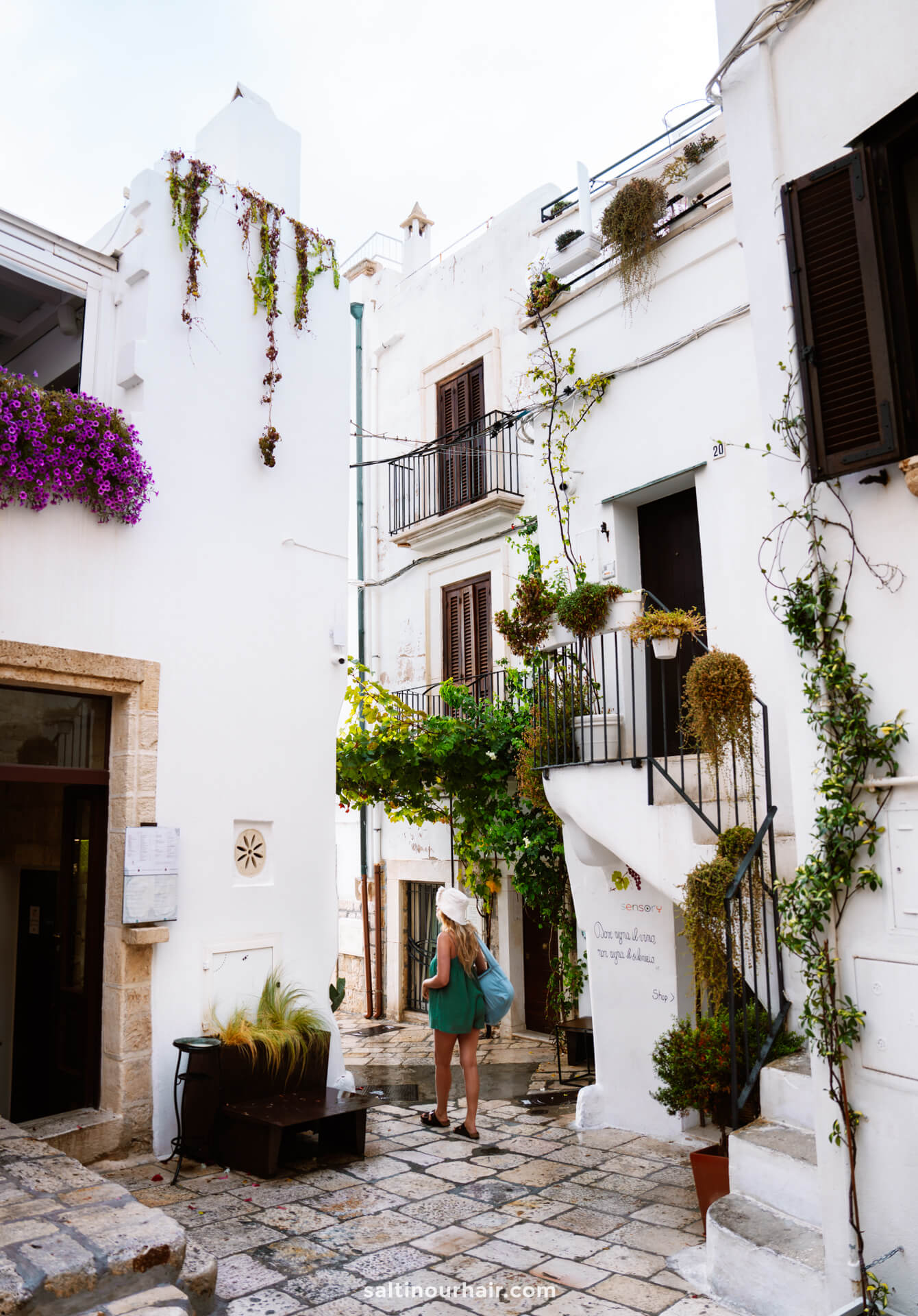 cute white streets Polignano a Mare vespa trip italy