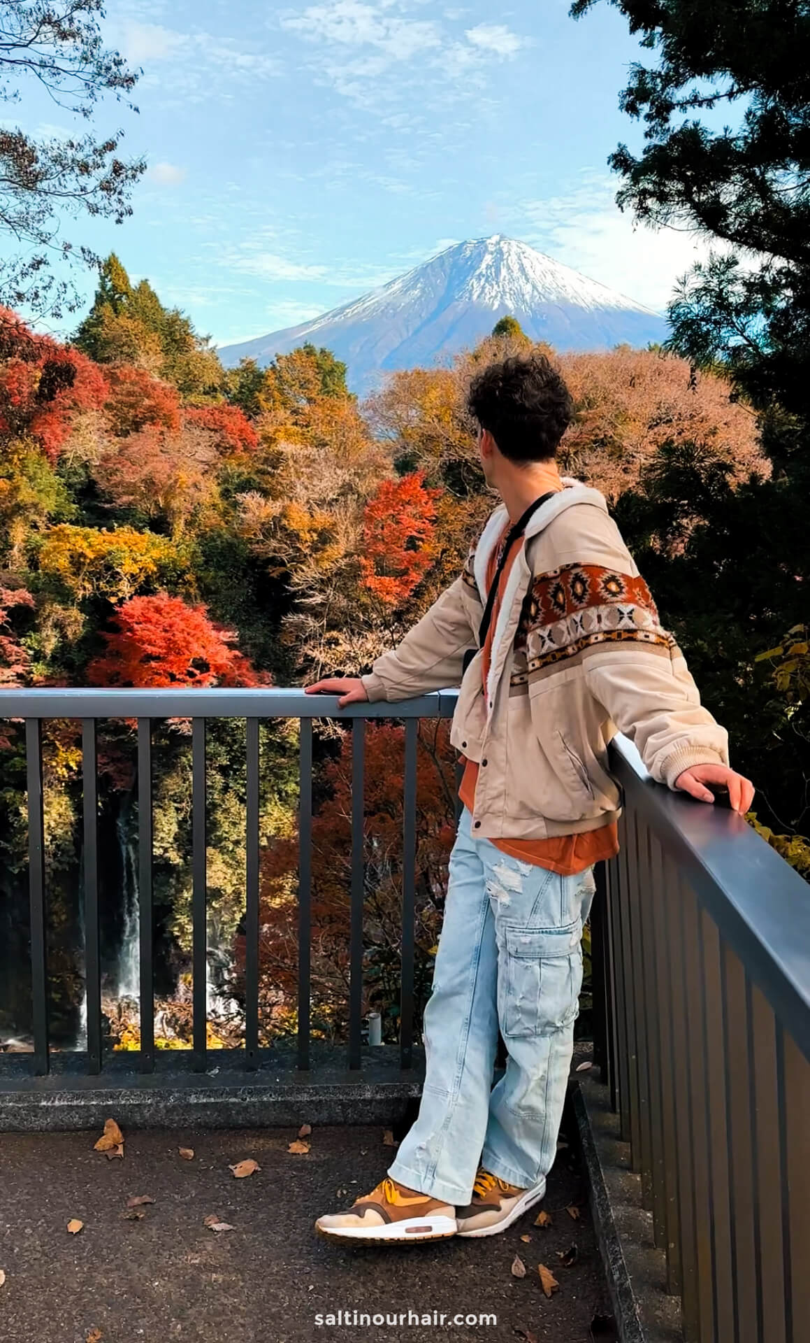 man admiring shiraito falls view on mount fuji japan