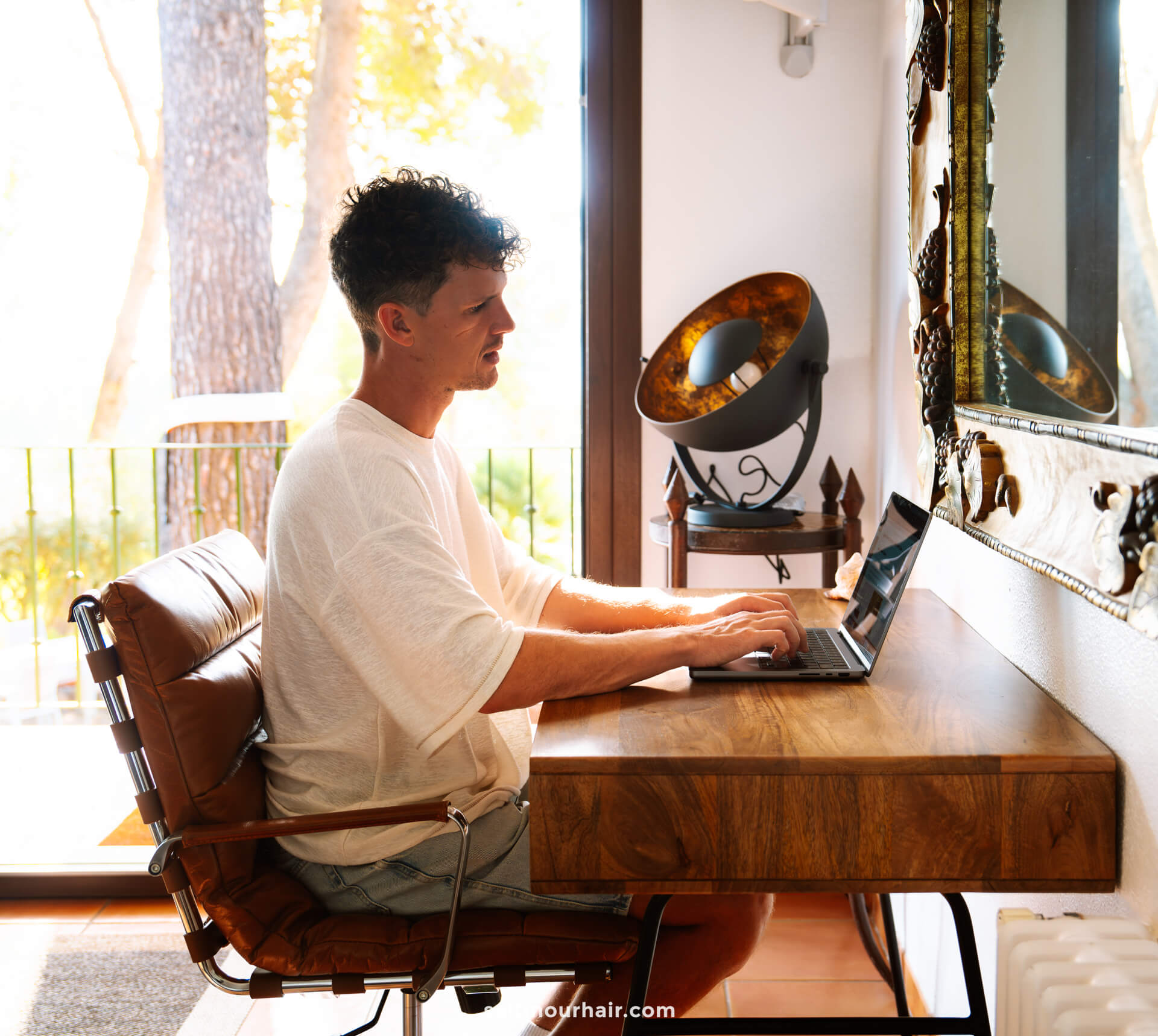 man writing blog on laptop 