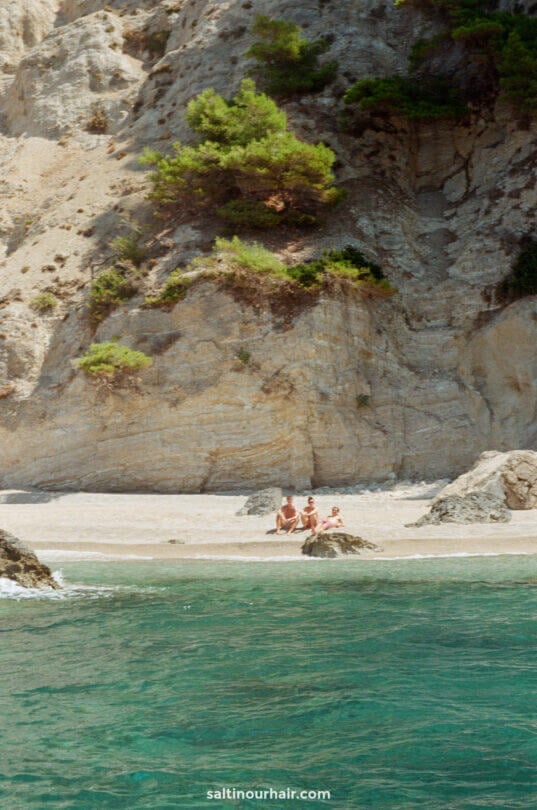 relaxing on remote beach corfu