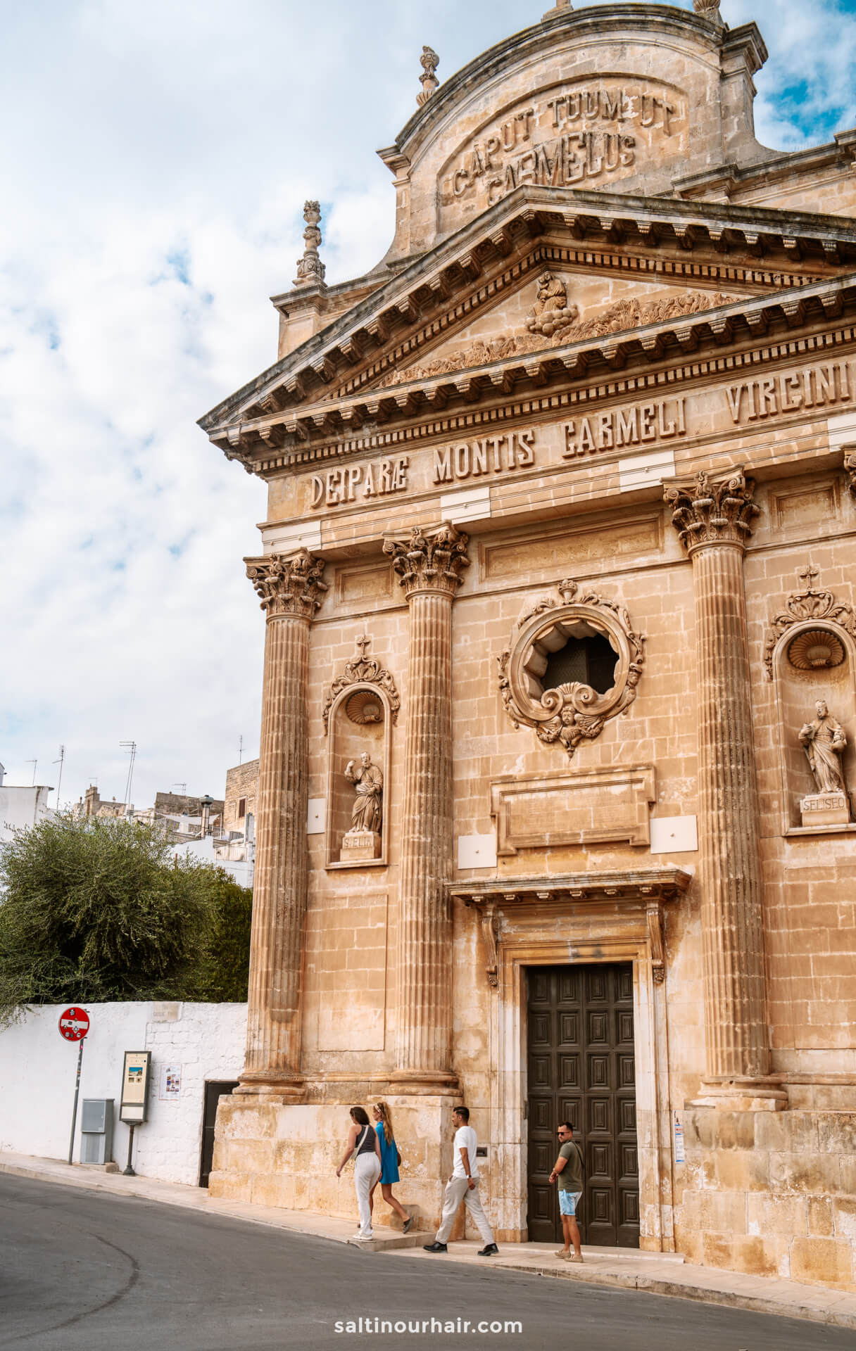 Historic stone church with columns and ornate details in Ostuni italy