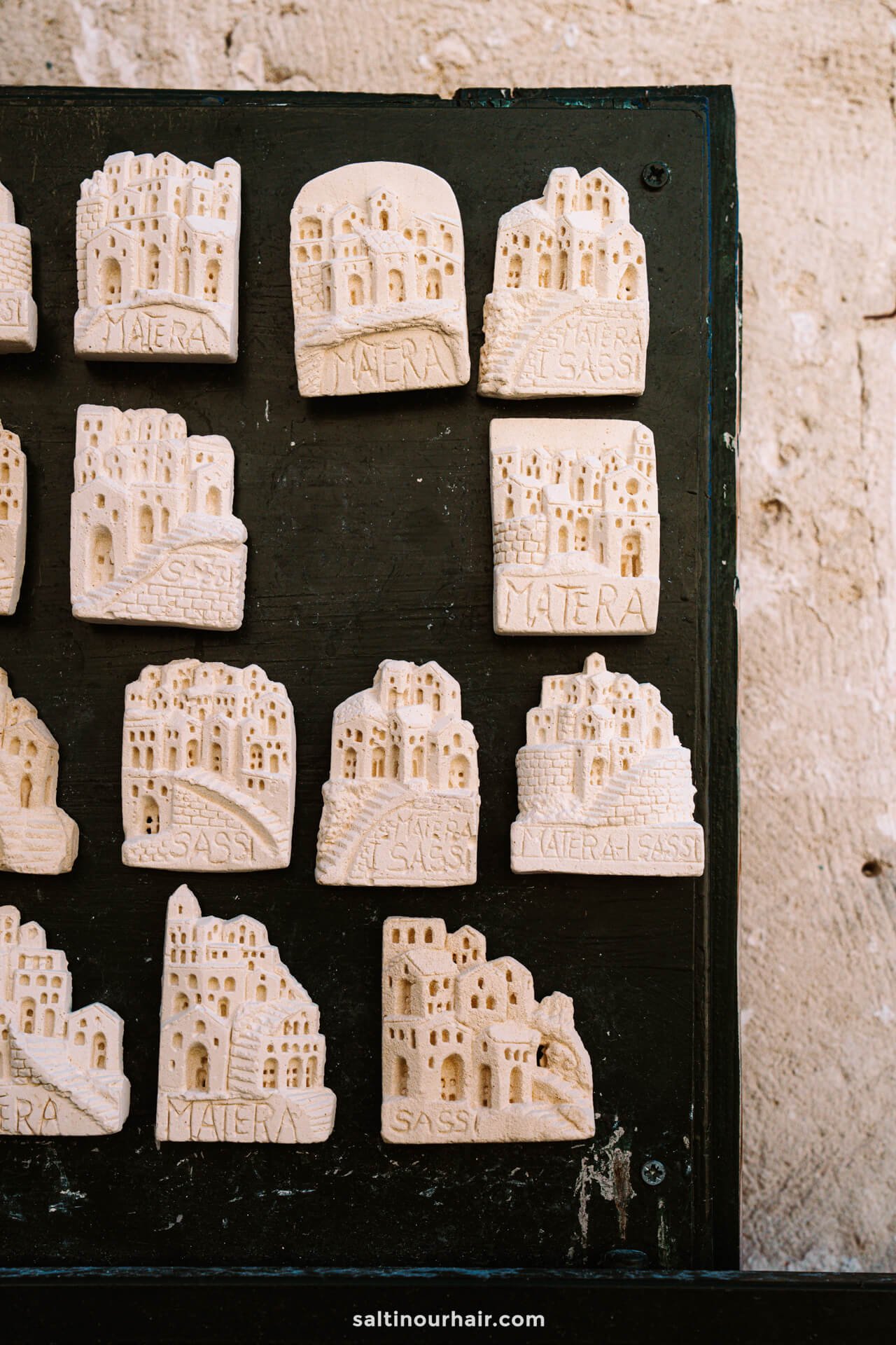 small stone magnets depicting the ancient cityscape of Matera, Italy