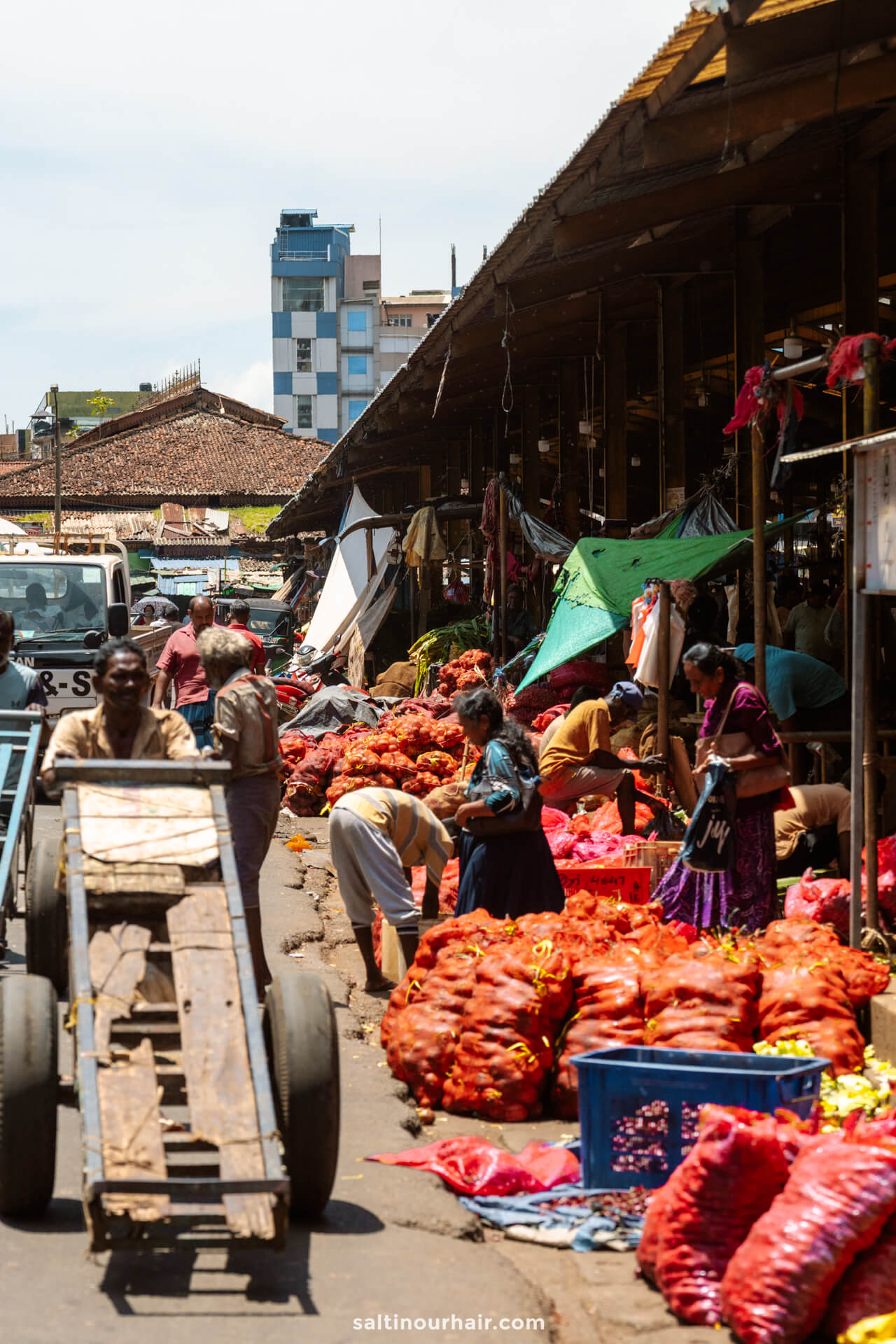 People work and shop among large sacks of produce at Pettah market. Colombo Sri Lanka&mdash;a vibrant scene that